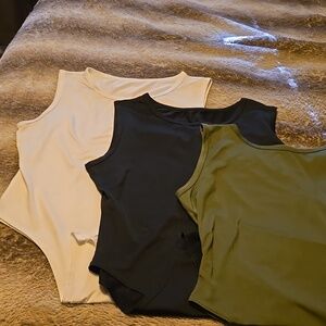 3 Body suits, never worn